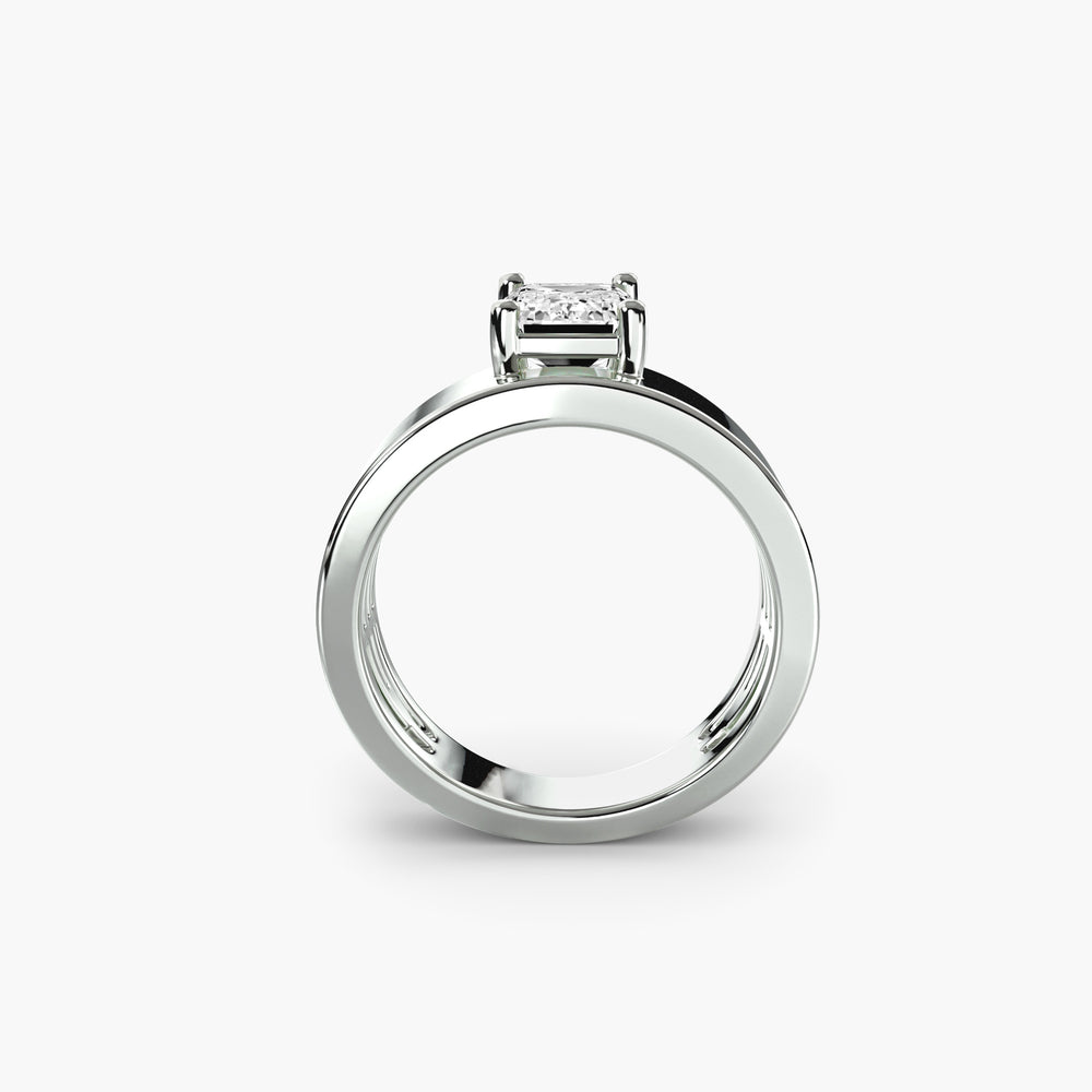 Wide Band Solitaire engagement ring in white gold with an emerald-cut centre stone, front view
