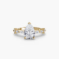 Solitaire with Eternity Pavé engagement ring in yellow gold with a pear-shaped centre stone
