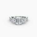 Three-Stone with Pavé Band engagement ring in white gold with an emerald-cut centre stone