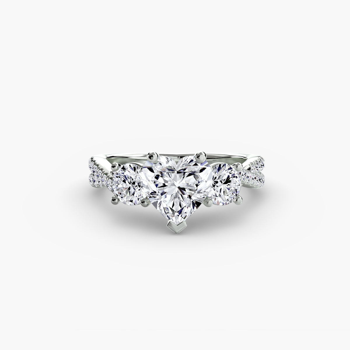 Three-Stone with Pavé Band engagement ring in white gold with a heart-shaped centre stone