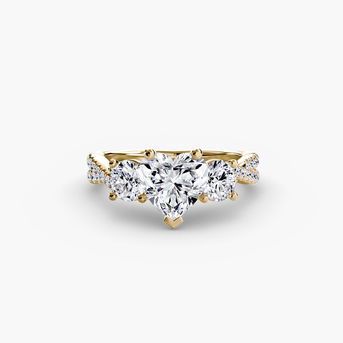 Three-Stone with Pavé Band engagement ring in yellow gold with a heart-shaped centre stone