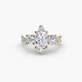 Three-Stone with Pavé Band engagement ring in yellow gold with a marquise centre stone