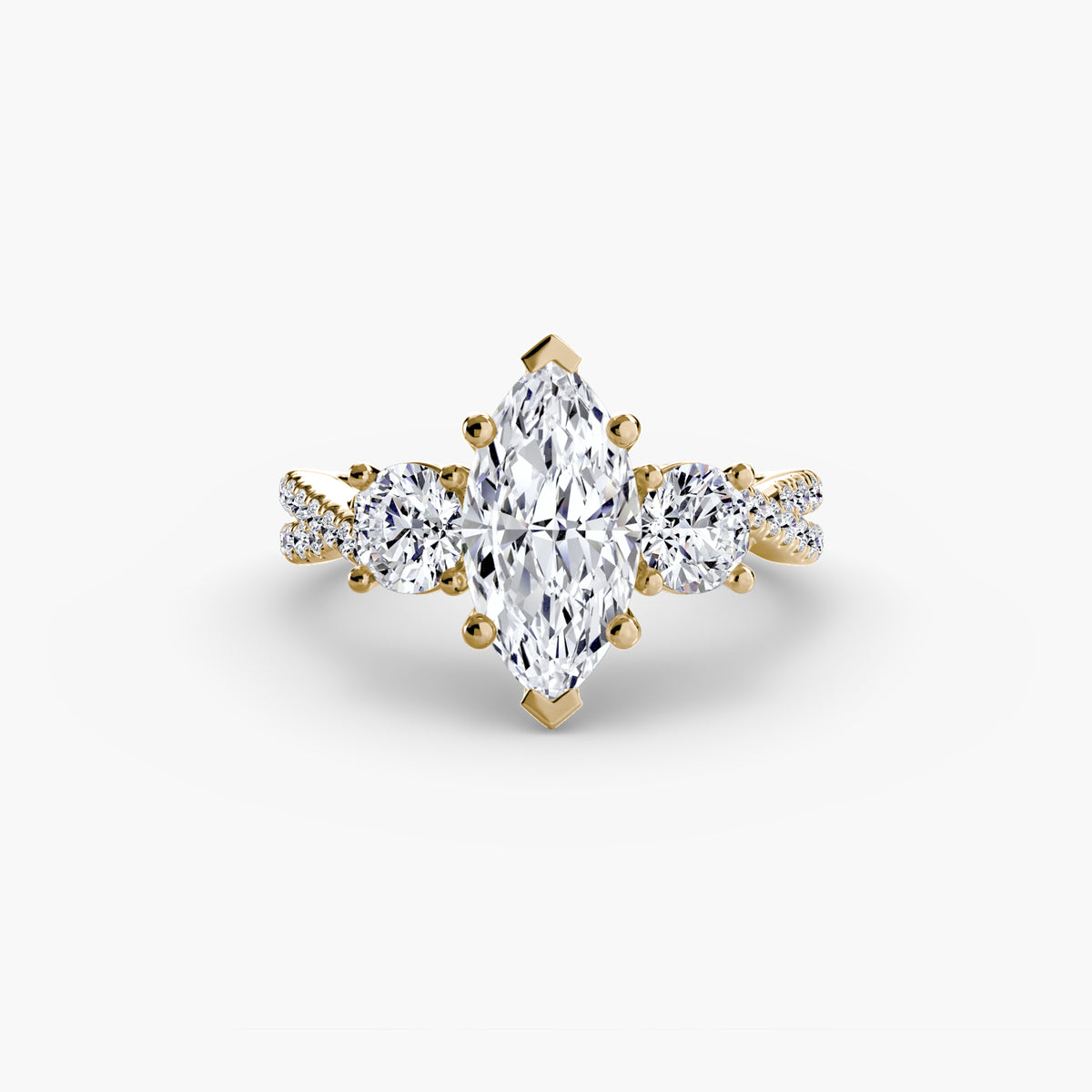 Three-Stone with Pavé Band engagement ring in yellow gold with a marquise centre stone