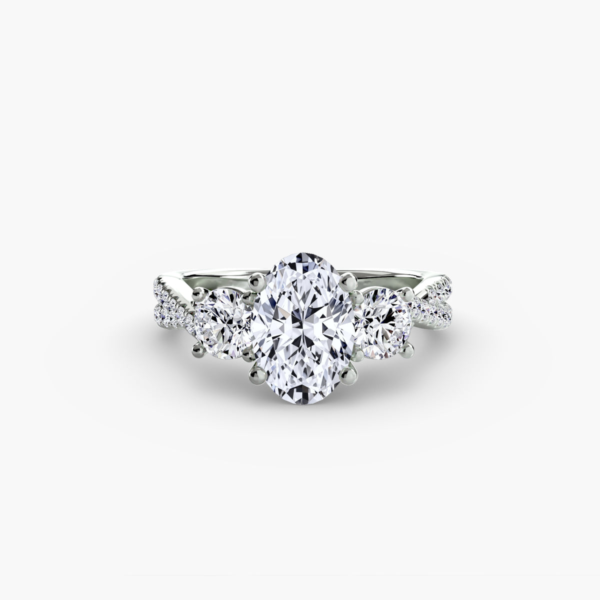 Three-Stone with Pavé Band engagement ring in white gold with an oval centre stone