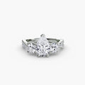 Three-Stone with Pavé Band engagement ring in white gold with a pear-shaped centre stone