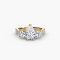 Three-Stone with Pavé Band engagement ring in yellow gold with a pear-shaped centre stone