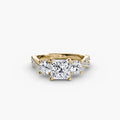 Three-Stone with Pavé Band engagement ring in yellow gold with a princess-cut centre stone