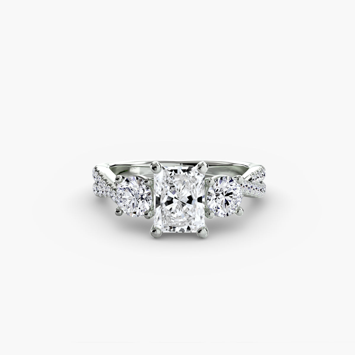 Three-Stone with Pavé Band engagement ring in white gold with a radiant-cut centre stone