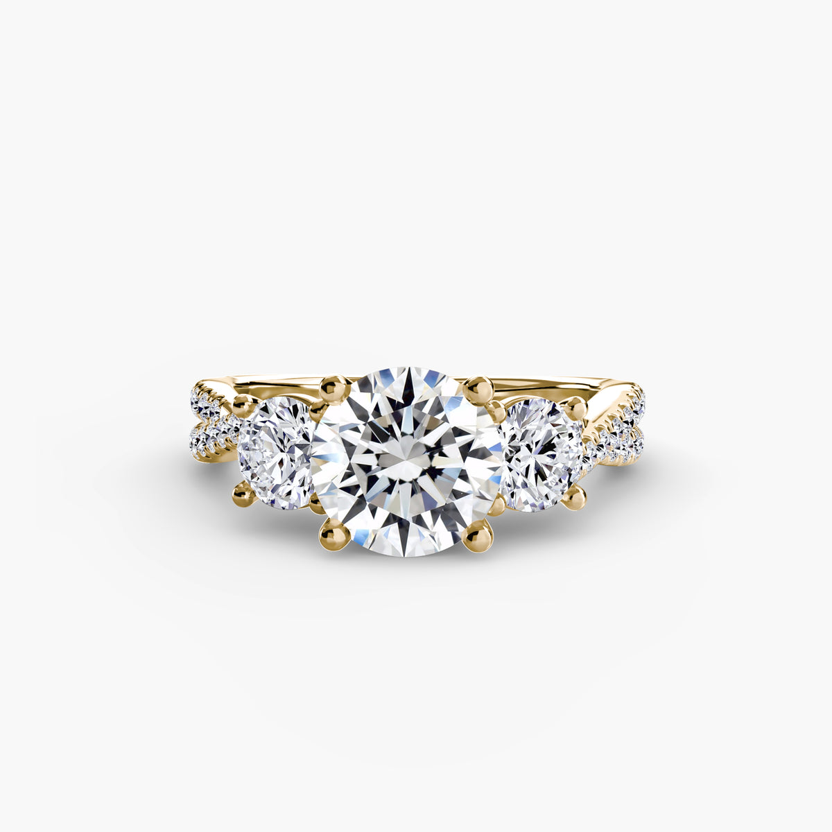 Three-Stone with Pavé Band engagement ring in yellow gold with a round centre stone
