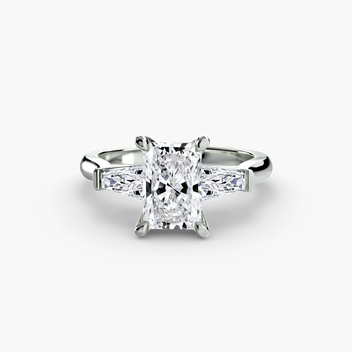 Three-Stone Ring (Baguette Side Stones) in white gold with a radiant-cut centre stone