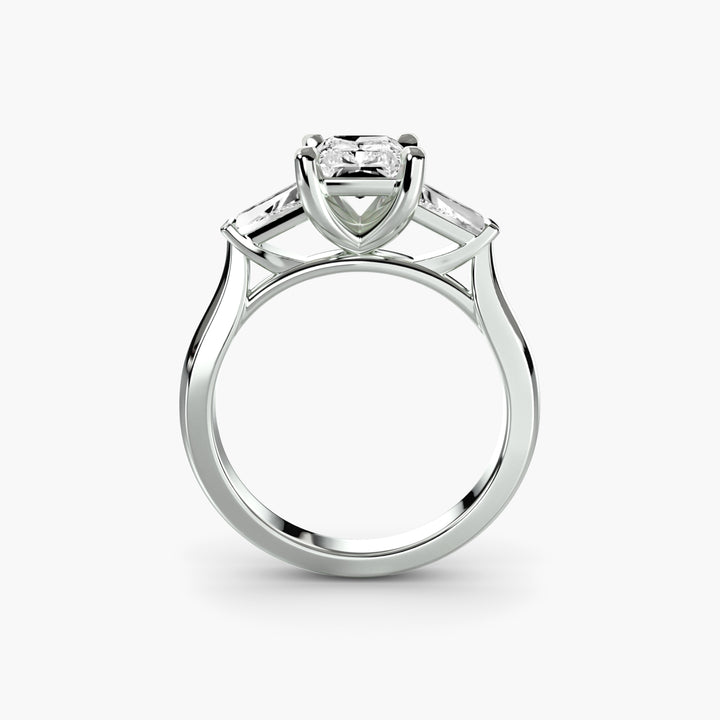 Three-Stone Ring (Baguette Side Stones) in white gold with a radiant-cut centre stone, front view