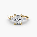 Three-Stone Ring (Baguette Side Stones) in yellow gold with a radiant-cut centre stone