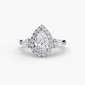 Three-Stone Ring with Halo in white gold with a pear-shaped centre stone