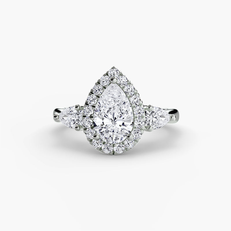 The Grosvenor Pear Three-Stone Halo