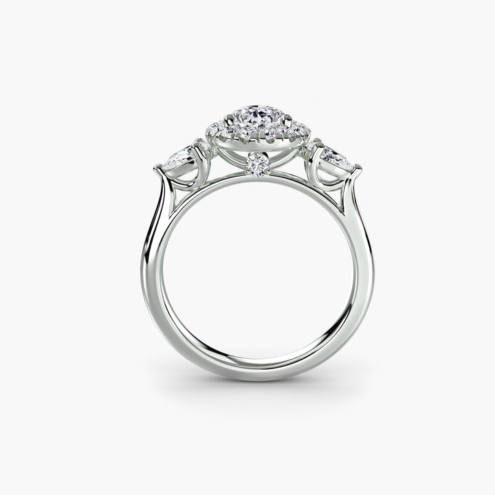 Three-Stone Ring with Halo in white gold with a pear-shaped centre stone, front view