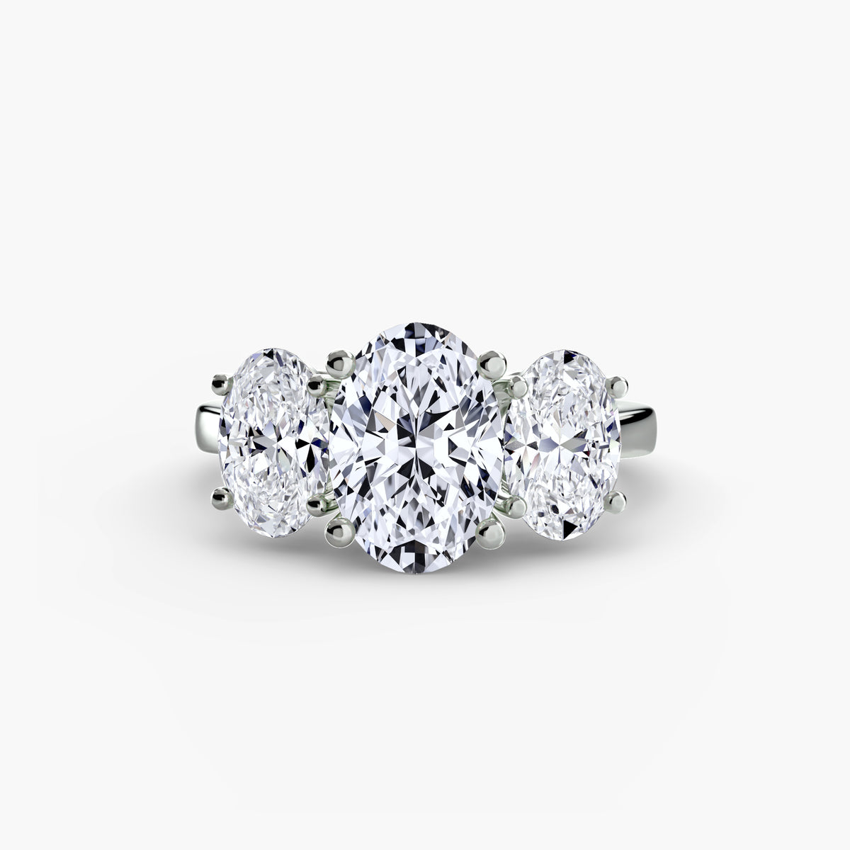 Trilogy Oval engagement ring in white gold with an oval centre stone