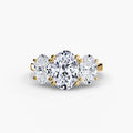 Trilogy Oval engagement ring in yellow gold with an oval centre stone