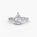 Three-Stone Ring with Pavé Band in white gold with a pear-shaped centre stone