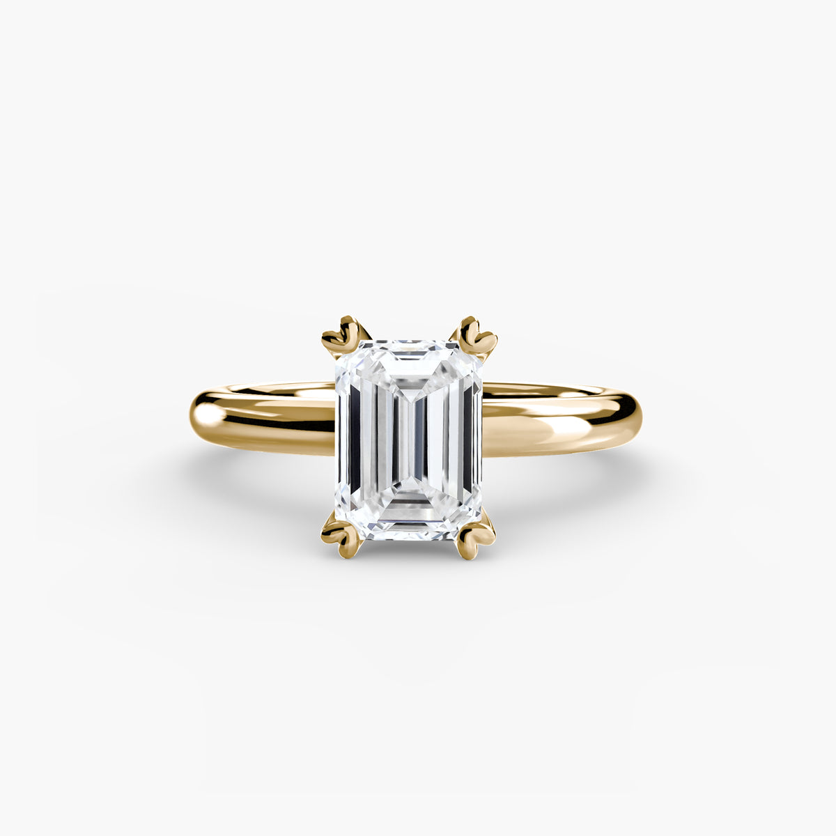 Solitaire ring in yellow gold with an emerald-cut centre stone
