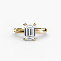 Solitaire ring in yellow gold with an emerald-cut centre stone