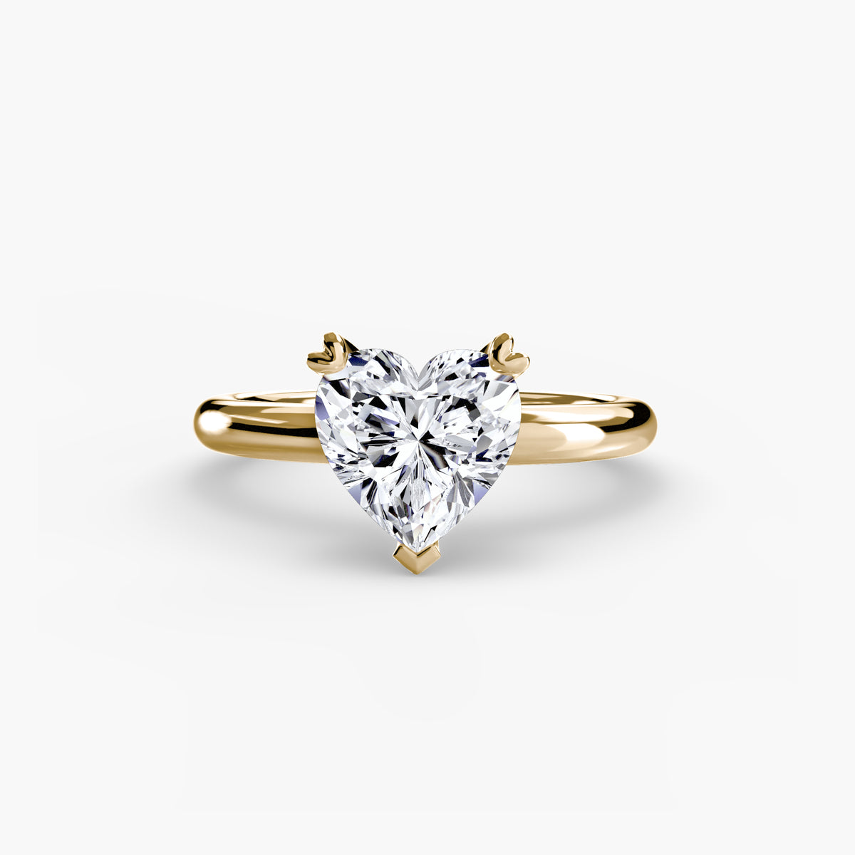 Solitaire ring in yellow gold with a heart-shaped centre stone