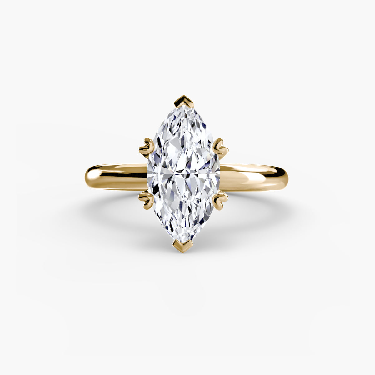 Solitaire ring in yellow gold with a marquise centre stone