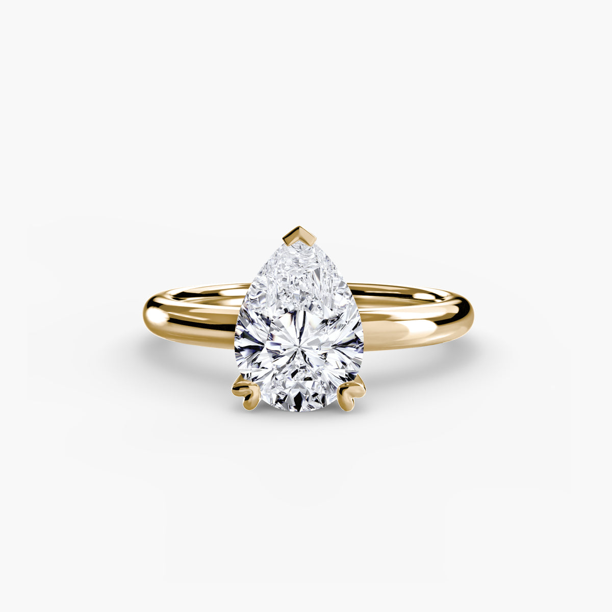 Solitaire ring in yellow gold with a pear-shaped centre stone