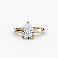 Solitaire ring in yellow gold with a pear-shaped centre stone