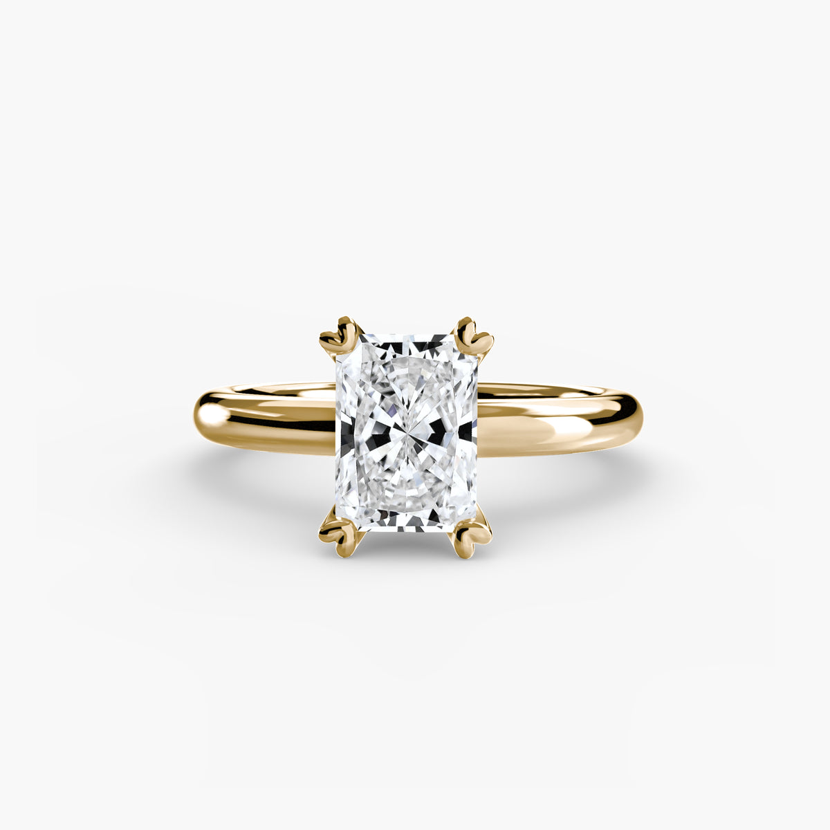 Solitaire ring in yellow gold with a radiant-cut centre stone