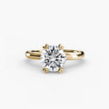 Solitaire ring in yellow gold with a round centre stone
