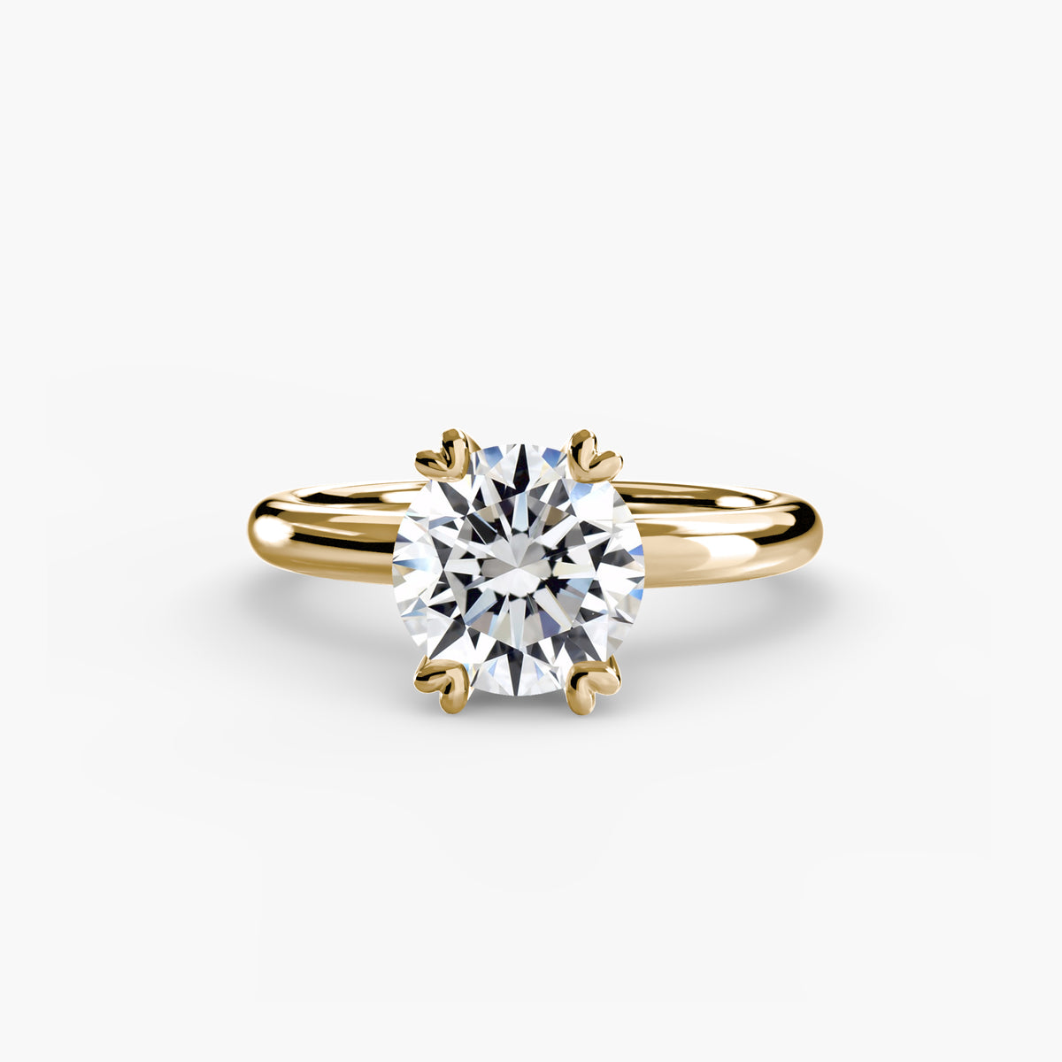 Solitaire ring in yellow gold with a round centre stone