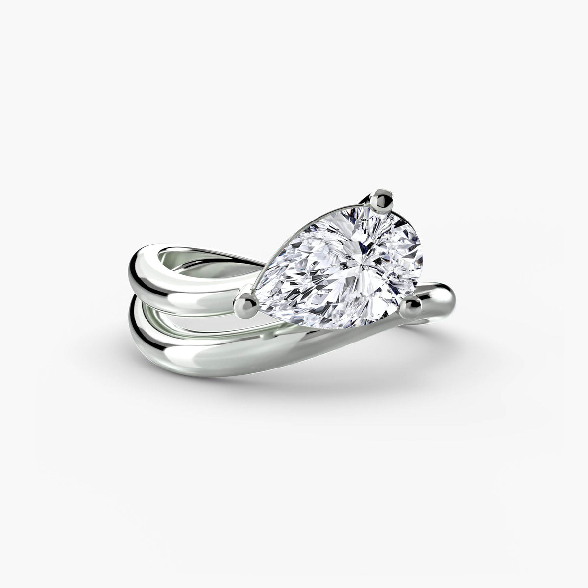 The Wave Ring in white gold with a pear-shaped centre stone