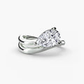The Wave Ring in white gold with a pear-shaped centre stone