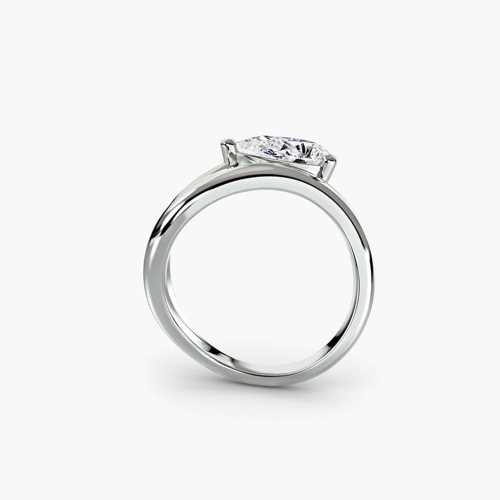 The Wave Ring in white gold with a pear-shaped centre stone, front view