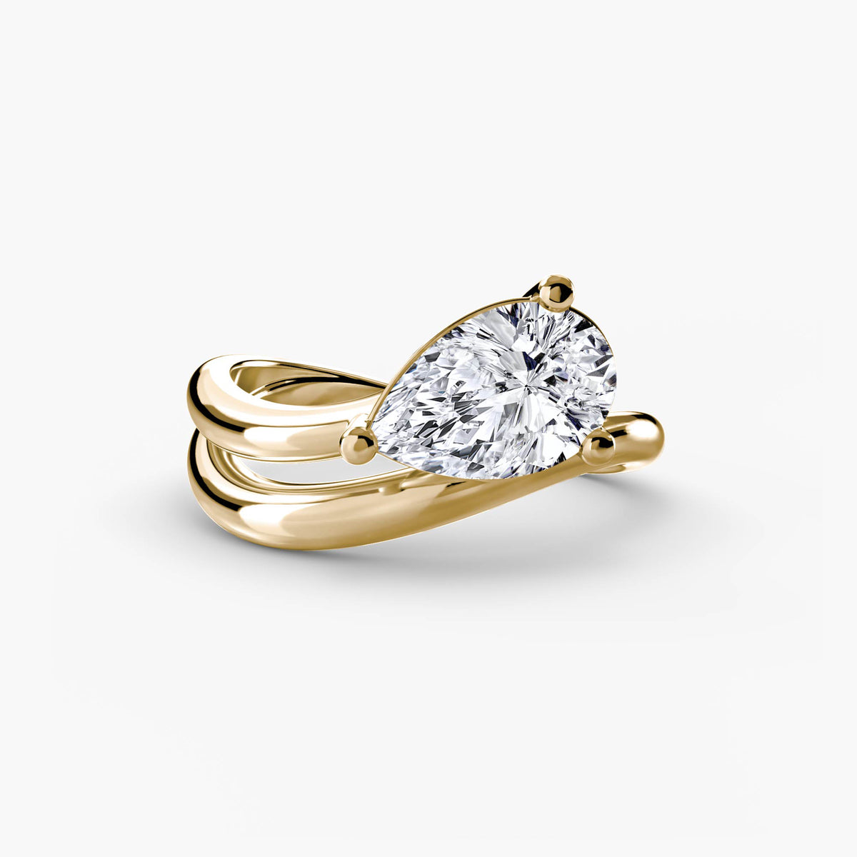 The Wave Ring in yellow gold with a pear-shaped centre stone