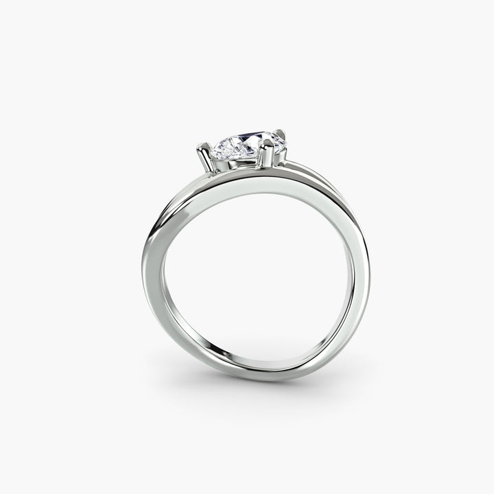 The Wave Ring in white gold with a pear-shaped centre stone, front view