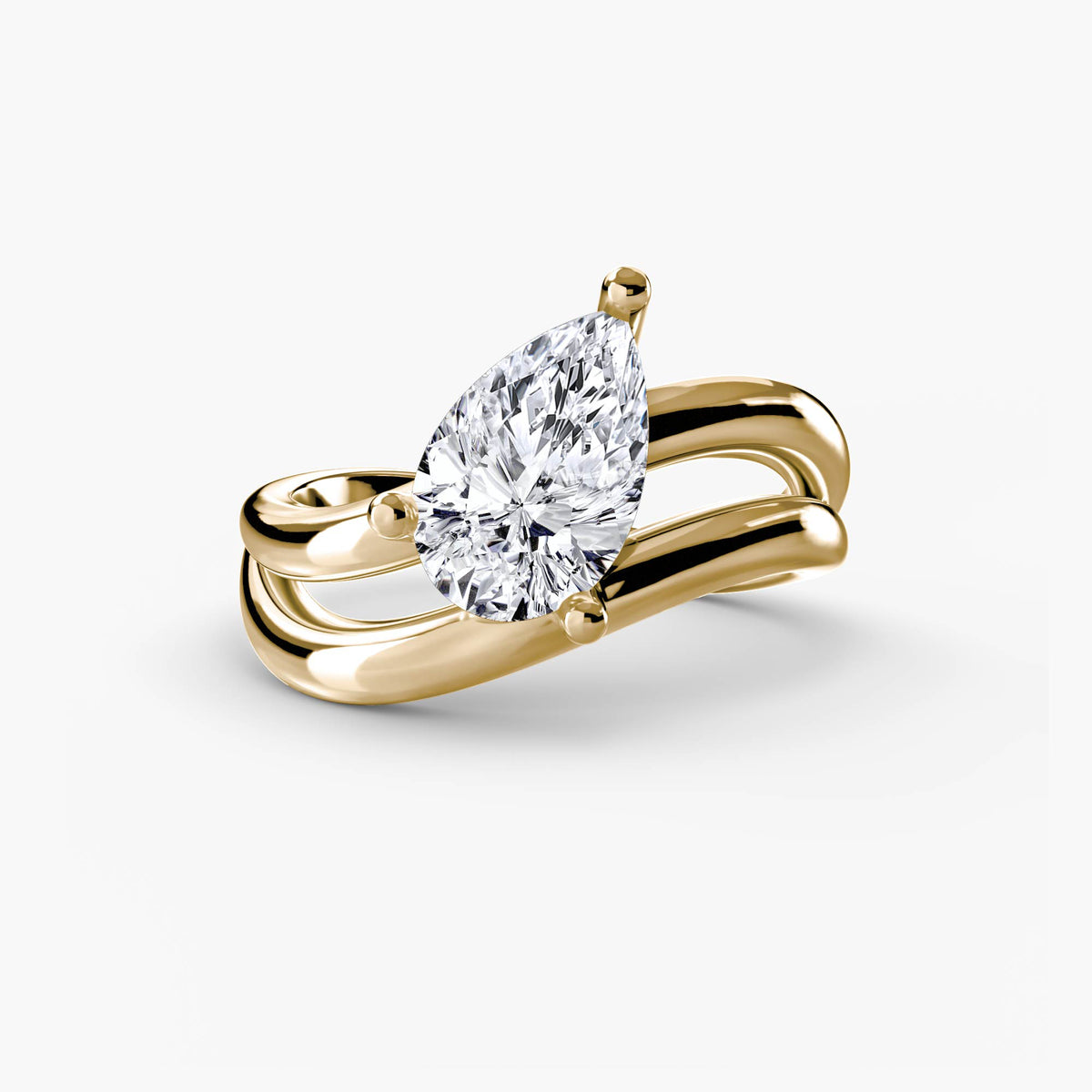 The Wave Ring in yellow gold with a pear-shaped centre stone