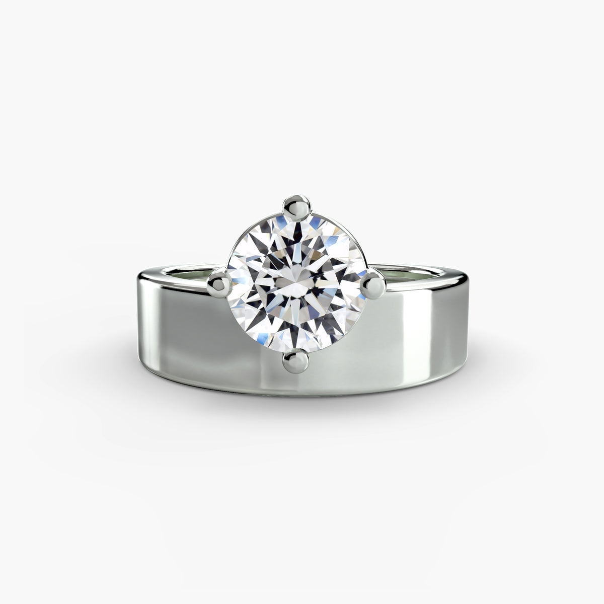 Wide Band Solitaire engagement ring in white gold with a round centre stone