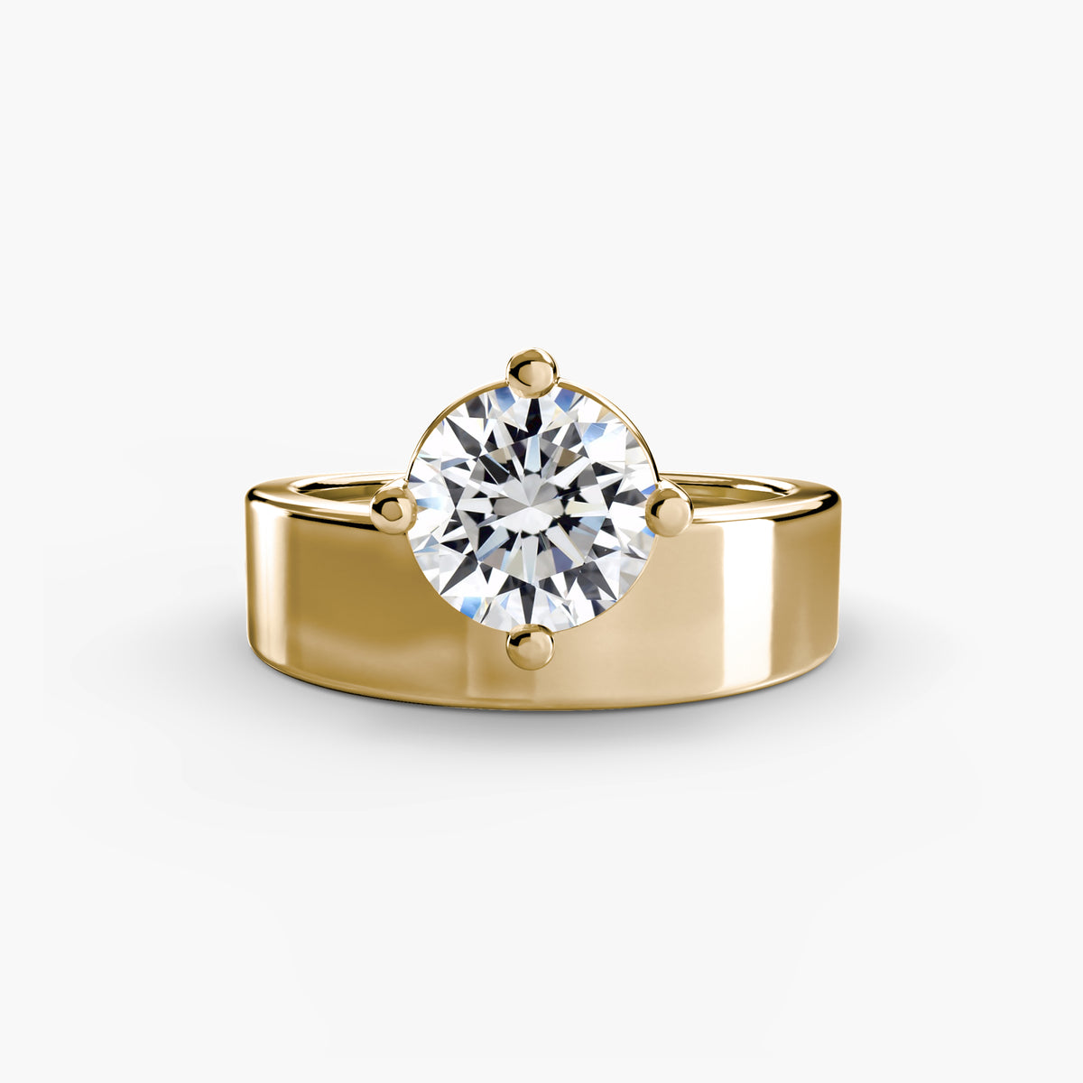 Wide Band Solitaire engagement ring in yellow gold with a round centre stone