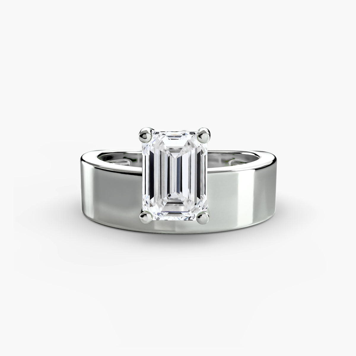 Wide Band Solitaire engagement ring in white gold with an emerald-cut centre stone