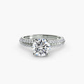 Solitaire with Pavé engagement ring in white gold with a round centre stone