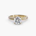 Solitaire with Pavé engagement ring in yellow gold with a round centre stone