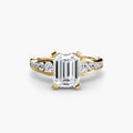 Solitaire with Pavé engagement ring in yellow gold with an emerald-cut centre stone