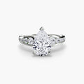 Solitaire with Pavé engagement ring in white gold with a pear-shaped centre stone