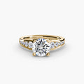 Solitaire with Pavé engagement ring in yellow gold with a round centre stone