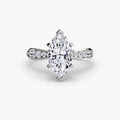 Solitaire with Pavé engagement ring in white gold with a marquise centre stone