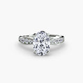 Solitaire with Pavé engagement ring in white gold with an oval centre stone