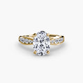 Solitaire with Pavé engagement ring in yellow gold with an oval centre stone
