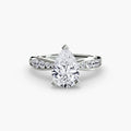 Solitaire with Pavé engagement ring in white gold with a pear-shaped centre stone