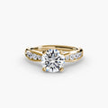 Solitaire with Pavé engagement ring in yellow gold